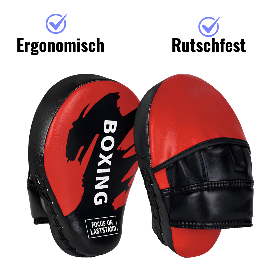 Box-Pratzen in Rot und Schwarz, ergonomisch gestaltet und rutschfest, ideal für intensives Training und präzise Schlagübungen.